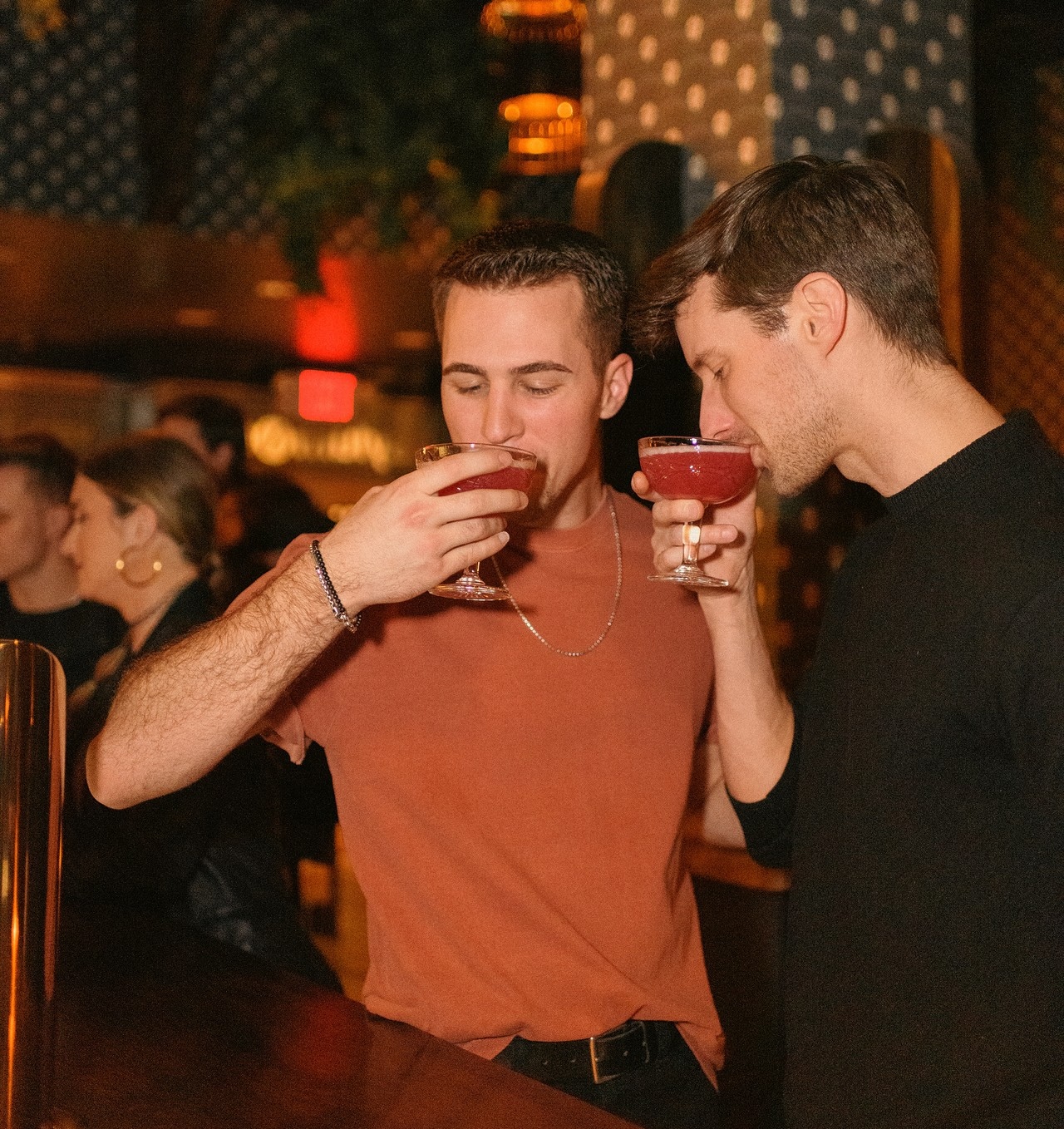 Two customers enjoying a cocktail at our bar before the show. 
